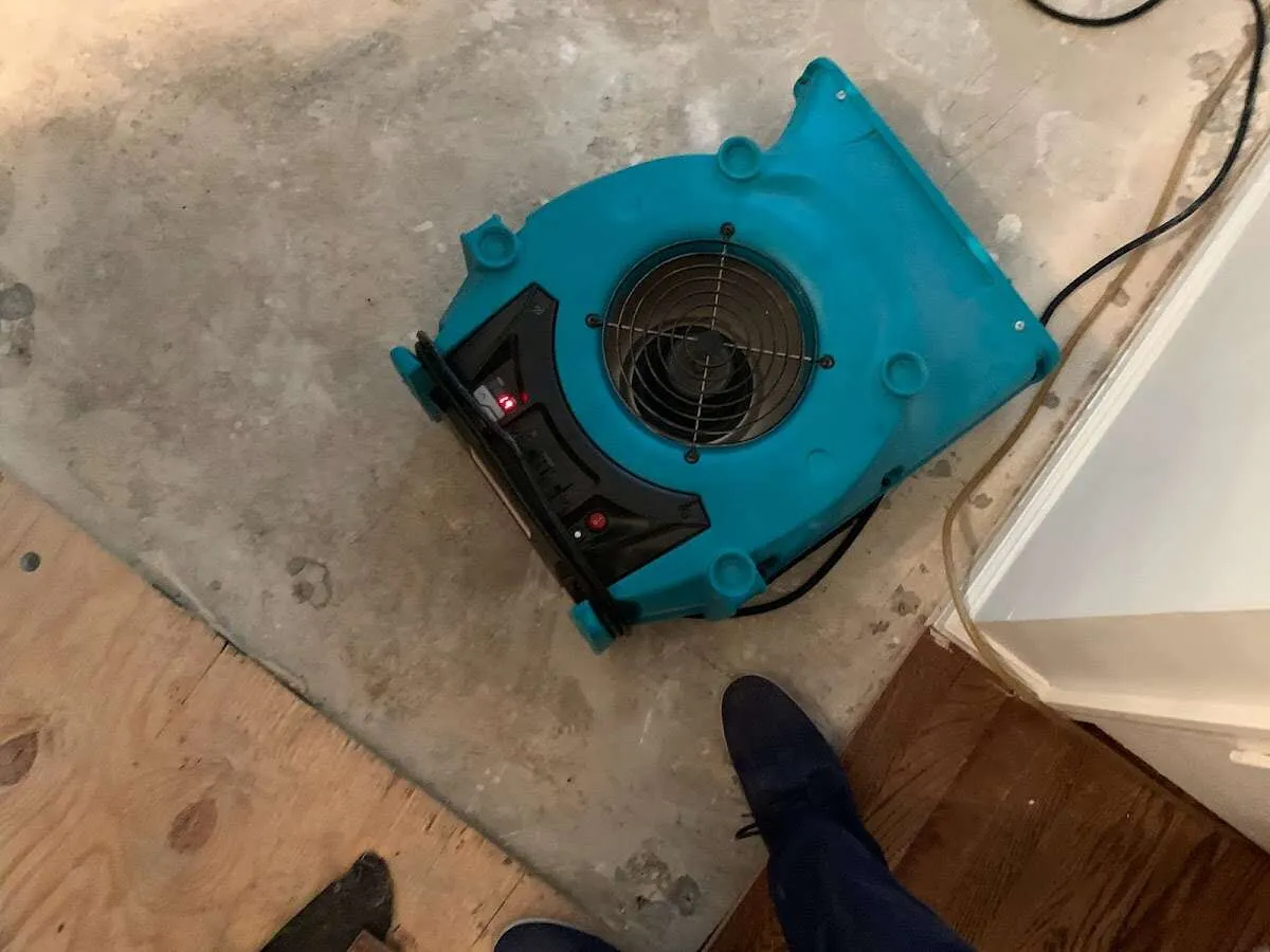 Air mover drying subfloor during Commercial Water Damage Restoration in Agoura Hills